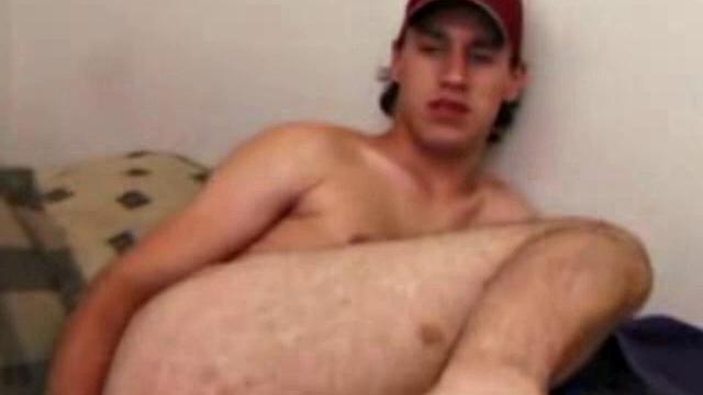 Ricky Underton quickly strips and starts tugging on his dick. He lubes up his ass and shoves a dildo deep inside. Next, he lubes up, and slides it in and out, while stroking his stiff dick.