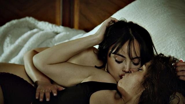 Sapphic busty lesbos in bed