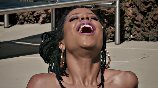 Watch this kinky black babe play with her trimmed pussy in the great outdoors