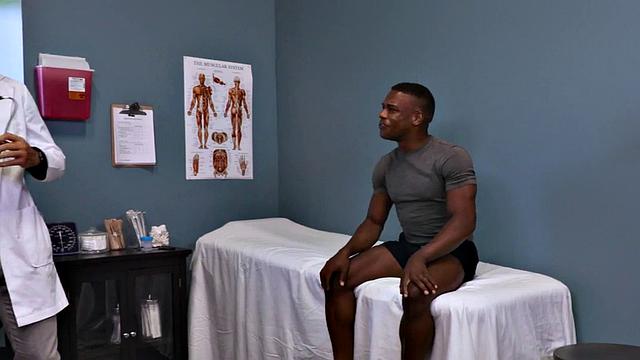 Black stud receives bj before bareback in doctors office