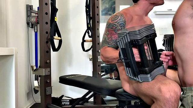Cocksucking stud barebacked in gym by inked partner