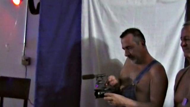 At Pigweek, in South Florida, Victor Cody films live porn brfore a packed house of horny men. We go behind the scenes for an inside look at this hardcore production featuring six porn stars, on a bench, bareback fucking out.