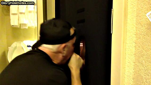 Gloryhole amateur DILF sucks and wanks penis at home