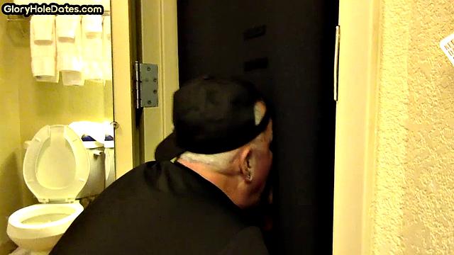 Gloryhole amateur DILF sucks and wanks penis at home