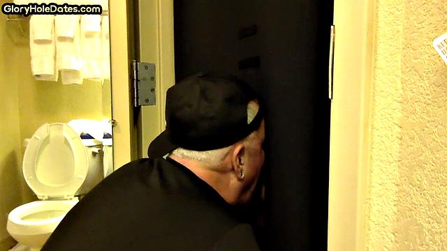Gloryhole amateur DILF sucks and wanks penis at home