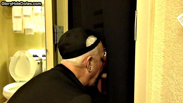 Gloryhole amateur DILF sucks and wanks penis at home