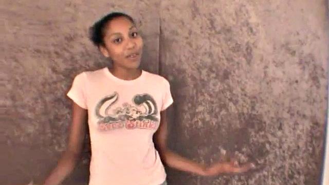 Slim amateur ebony teen fucks her pussy with a dildo in solo