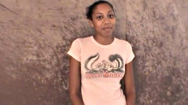 Slim amateur ebony teen fucks her pussy with a dildo in solo