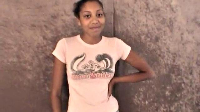 Slim amateur ebony teen fucks her pussy with a dildo in solo