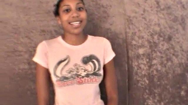 Slim amateur ebony teen fucks her pussy with a dildo in solo