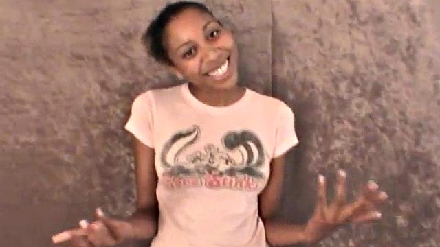 Slim amateur ebony teen fucks her pussy with a dildo in solo