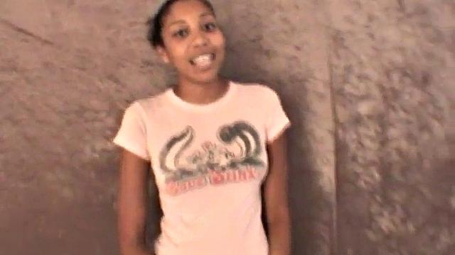 Slim amateur ebony teen fucks her pussy with a dildo in solo