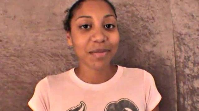 Slim amateur ebony teen fucks her pussy with a dildo in solo