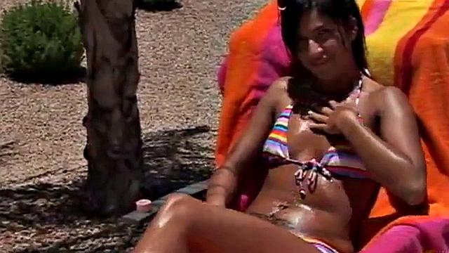 Hot teen sunbathing outdoors in the sun