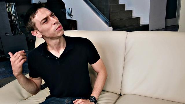 Curly-haired babe in jeans goes naked in the living room and gets fucked from behind