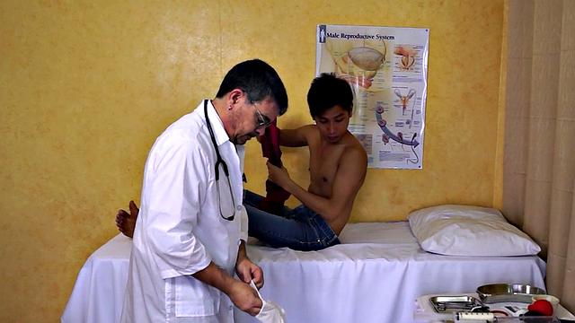 Mature doctor examines Asian enema and twink