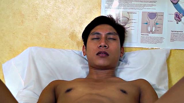 Mature doctor examines Asian enema and twink
