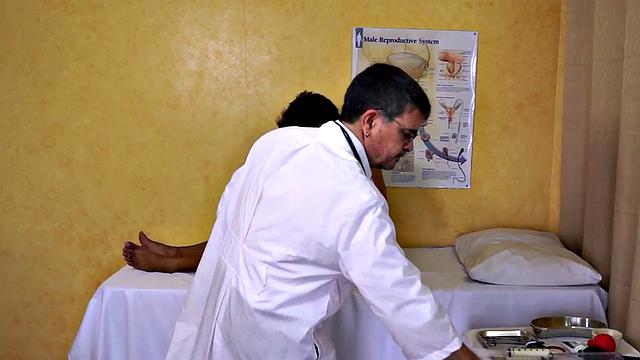 Mature doctor examines Asian enema and twink