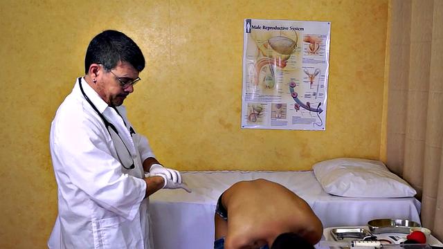 Mature doctor examines Asian enema and twink