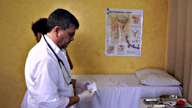 Mature doctor examines Asian enema and twink