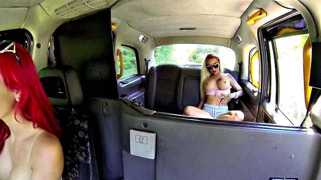 Busty Babes with tattoos get naughty in a cab cab
