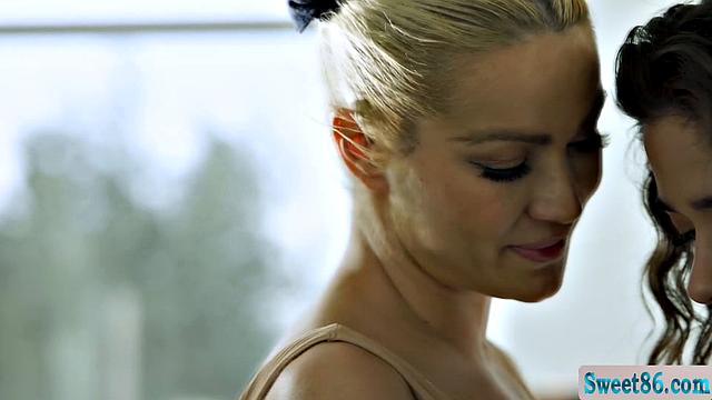 Curly haired brunette sits on trainers face