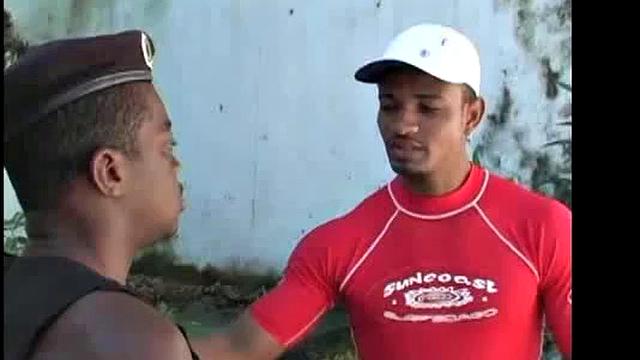 Emilio Calvo arrives to admire guard Jose Marcos' uniform. It's not long before Jose's uncut cock is being admired.
