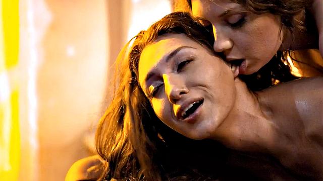 Massaging lesbian seduces oiled babe and scissors her