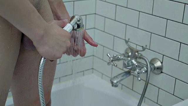 Handsome buff hunk jerking in shower session