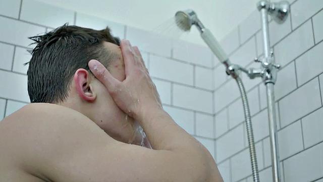 Handsome buff hunk jerking in shower session