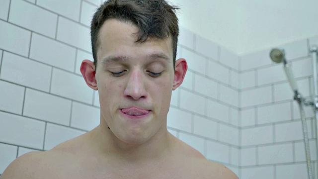 Handsome buff hunk jerking in shower session