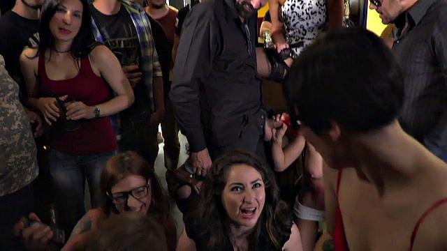 Submissive babe publicly deepthroats BWCs in group sex