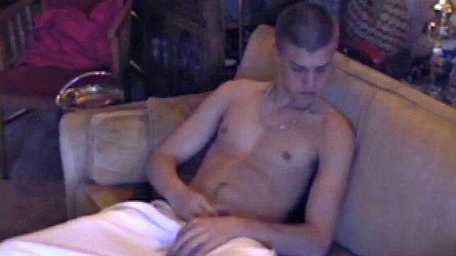 Lance starts this scene sitting on the sofa with his sweats pulled down just below his balls. Lance talks to the camera a bit, asking if we like his dick.