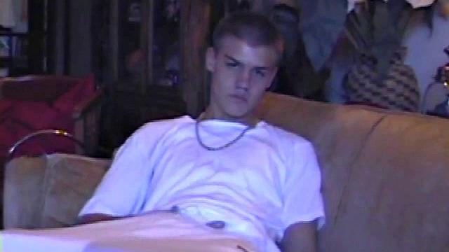 Lance starts this scene sitting on the sofa with his sweats pulled down just below his balls. Lance talks to the camera a bit, asking if we like his dick.