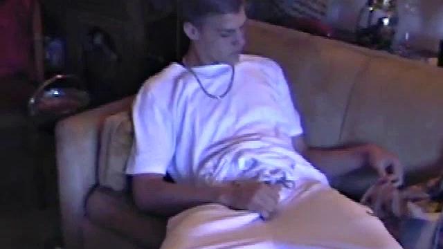 Lance starts this scene sitting on the sofa with his sweats pulled down just below his balls. Lance talks to the camera a bit, asking if we like his dick.