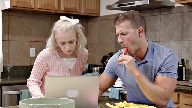 Busty redhead enjoys pussy drill in the kitchen