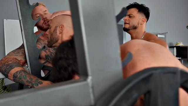 Eager inked jocks group banging in gym after workout