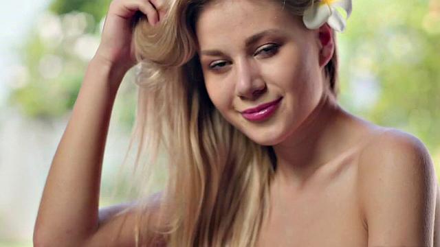 Blonde babe loses control and gets her bald pussy pierced in the pool