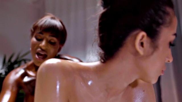 Sensual ethnic goddess scissoring ebony at massage