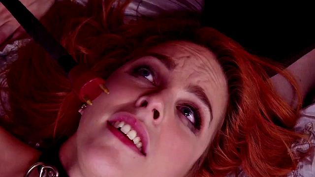 Bound redhead nipple clamped and zapped in threesome