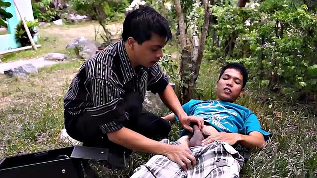 Asian doctor helping twinks cock with blowjob