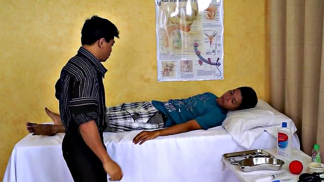 Asian doctor helping twinks cock with blowjob