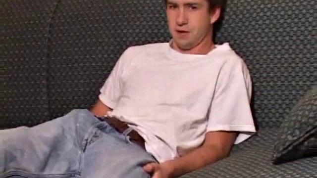 As the video plays, young Donovan Woodside kicks back on a couch and works up a stiff one. Some serious stroking follows, with a little ass play for added stimulation.