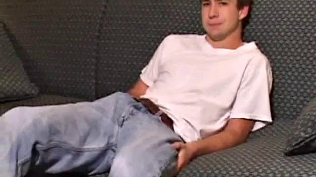 As the video plays, young Donovan Woodside kicks back on a couch and works up a stiff one. Some serious stroking follows, with a little ass play for added stimulation.