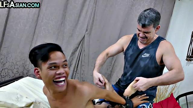 Tickled Asian twink barebacked by white gaydaddy top