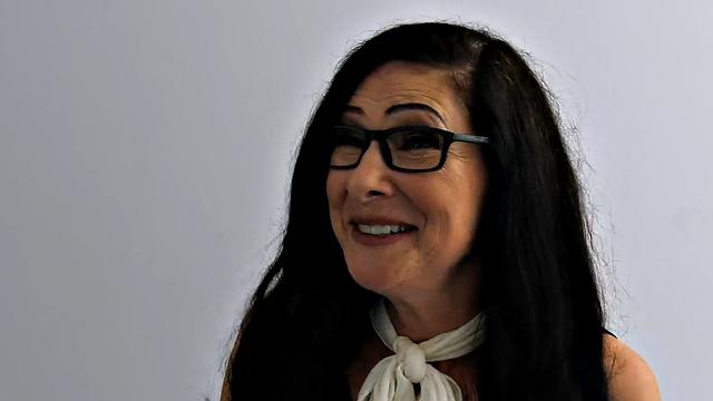 Hairy cougar in stockings rides cock