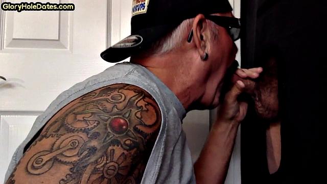 Gloryhole tattooed DILF sucks cock in private amateur BJ
