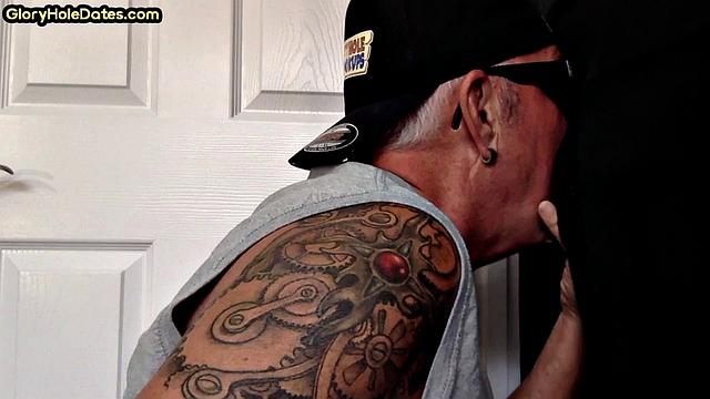 Gloryhole tattooed DILF sucks cock in private amateur BJ