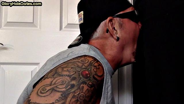 Gloryhole tattooed DILF sucks cock in private amateur BJ