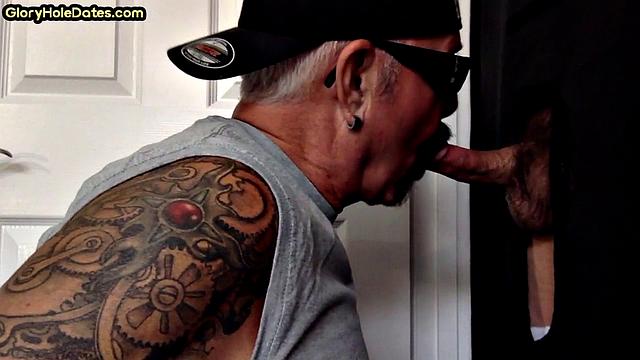 Gloryhole tattooed DILF sucks cock in private amateur BJ